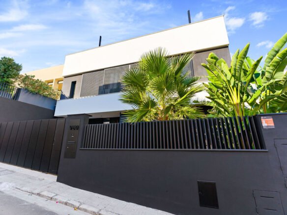 Impressive facade of an elevated sea view villa in Palma de Mallorca, showcasing contemporary architecture and stunning coastal surroundings.