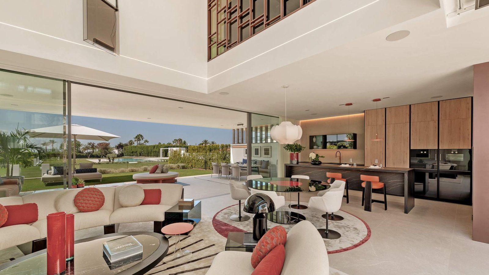 Elegant living room in an exclusive residence near Puente Romano, Marbella Golden Mile, featuring high-end furnishings, large windows offering abundant natural light, and a sophisticated design with modern art and décor. The space is perfect for both relaxation and entertaining, with a luxurious and inviting atmosphere.