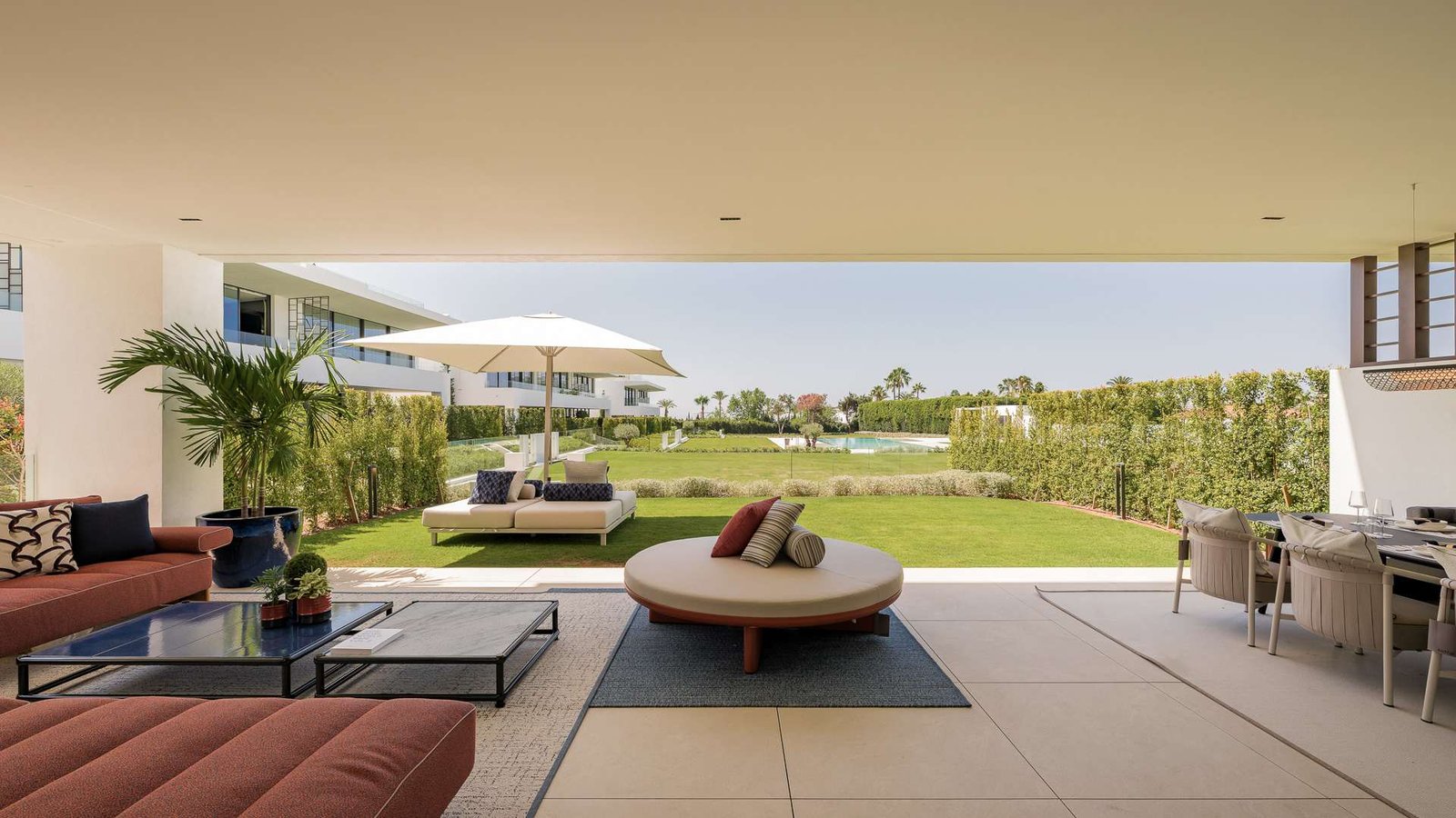 Luxurious terrace of an exclusive residence near Puente Romano on the Golden Mile, featuring elegant outdoor seating, warm ambient lighting, and breathtaking views. The sophisticated design seamlessly extends the indoor living space, creating a serene and stylish setting for relaxation and entertaining.