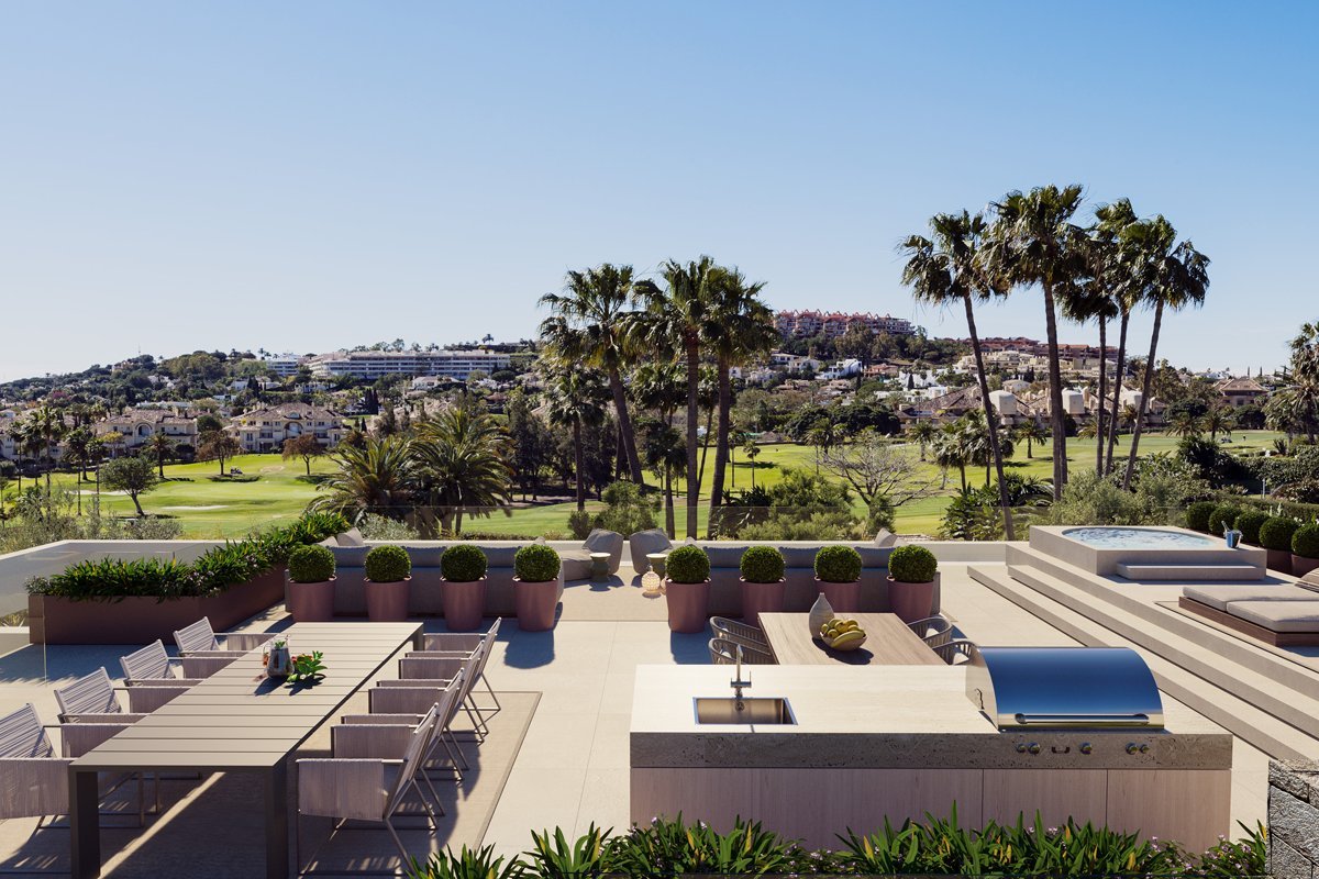 Stunning solarium in a frontline golf villa in Marbella, featuring stylish outdoor seating, a sleek design, and sweeping views of the lush golf course. The elevated space offers a perfect spot for sunbathing, relaxation, or enjoying the serene surroundings, providing an exceptional blend of luxury and nature.