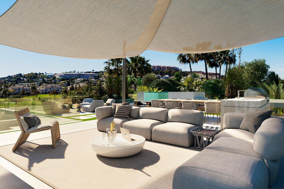 Beautiful terrace of a frontline golf villa in Marbella, offering panoramic views of the lush golf course and surrounding landscape. The space features elegant outdoor seating and contemporary design elements, creating the perfect setting for relaxation or entertaining while enjoying the tranquil ambiance and green vistas.
