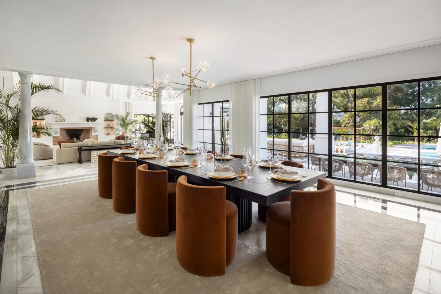 Elegant dining room in a majestic Andalusian palace in Marbella, featuring a grand dining table, intricate ceiling designs, and luxurious furnishings, creating a sophisticated atmosphere perfect for hosting formal dinners and gatherings in a timeless setting.