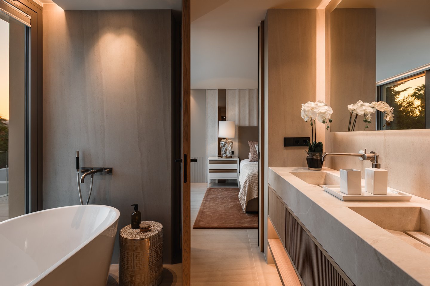 Sleek bathroom in a modern villa in Nueva Andalucía, featuring contemporary fixtures, elegant marble finishes, a spacious walk-in shower, and large windows that bring in natural light, creating a luxurious and tranquil spa-like atmosphere.