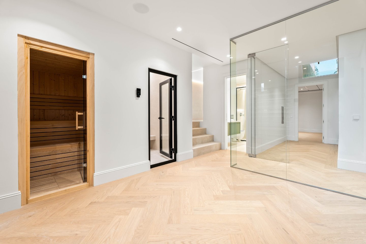 Inviting entrance to a refined villa in Nueva Andalucía, where luxury meets Provençal charm. The entryway features elegant stonework, beautiful wooden doors, and lush landscaping, creating a warm and welcoming atmosphere. The classic design, combined with modern touches, sets the tone for the villa’s sophisticated yet timeless aesthetic.
